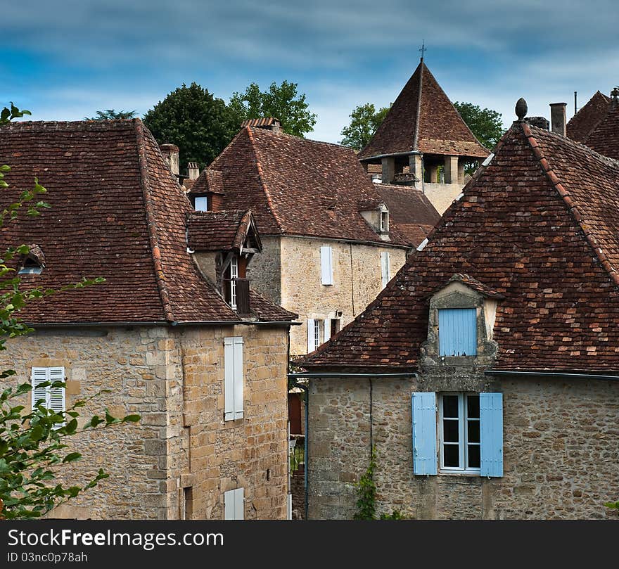 The village of Limeuil in France, rooftops and church. The village of Limeuil in France, rooftops and church