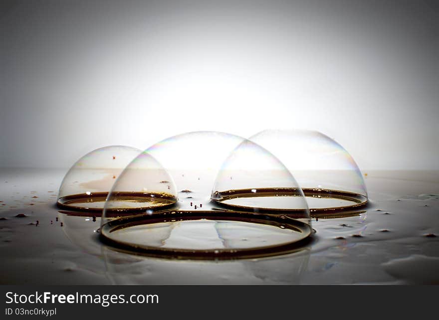 Bubbles and droplets on white surface. Bubbles and droplets on white surface