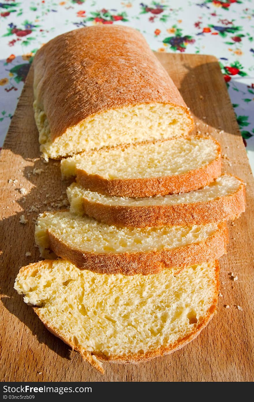 Sliced homemade sicilian bread on wooden board outdoor