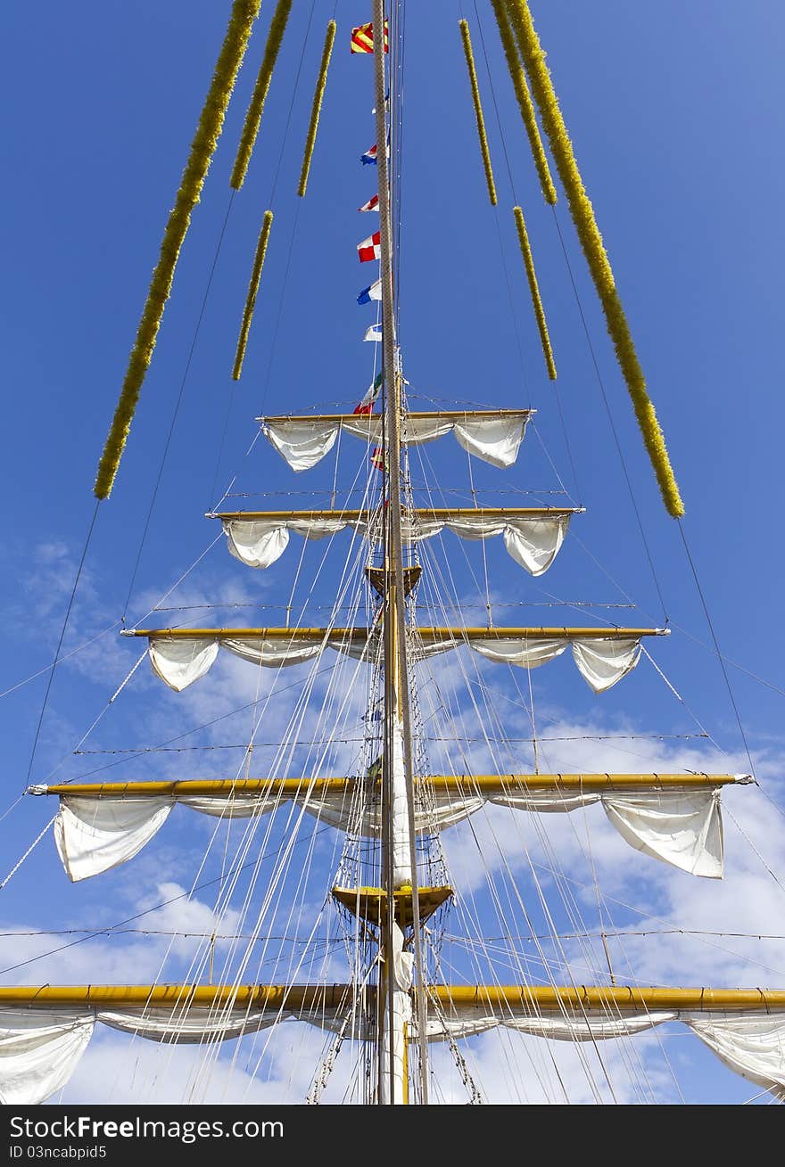 Ship's mast front view on the blue sky. Ship's mast front view on the blue sky