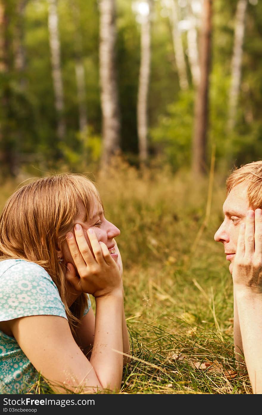 Young couple dreaming in summer nature