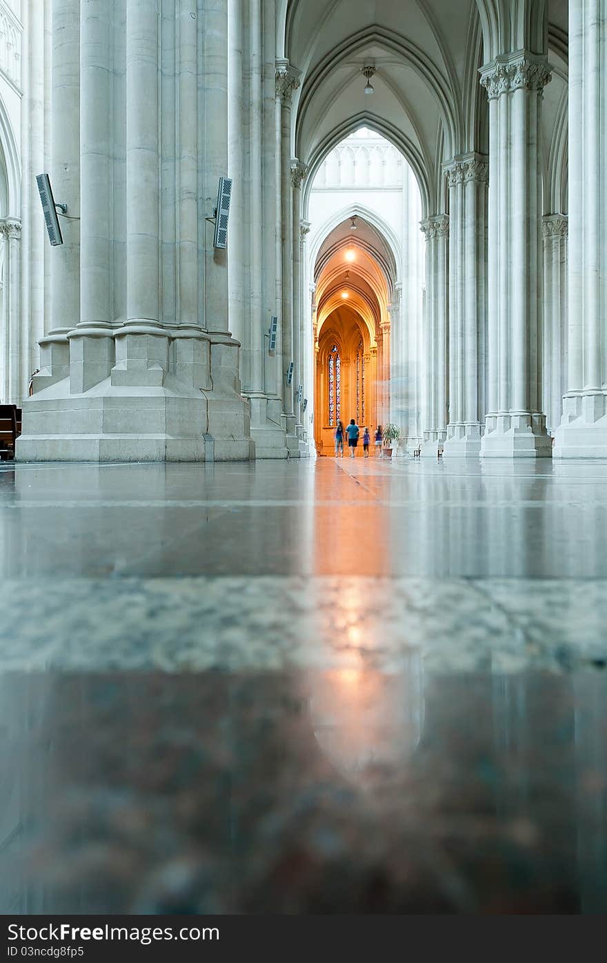 Women, girl and boy walking in the Cathedral