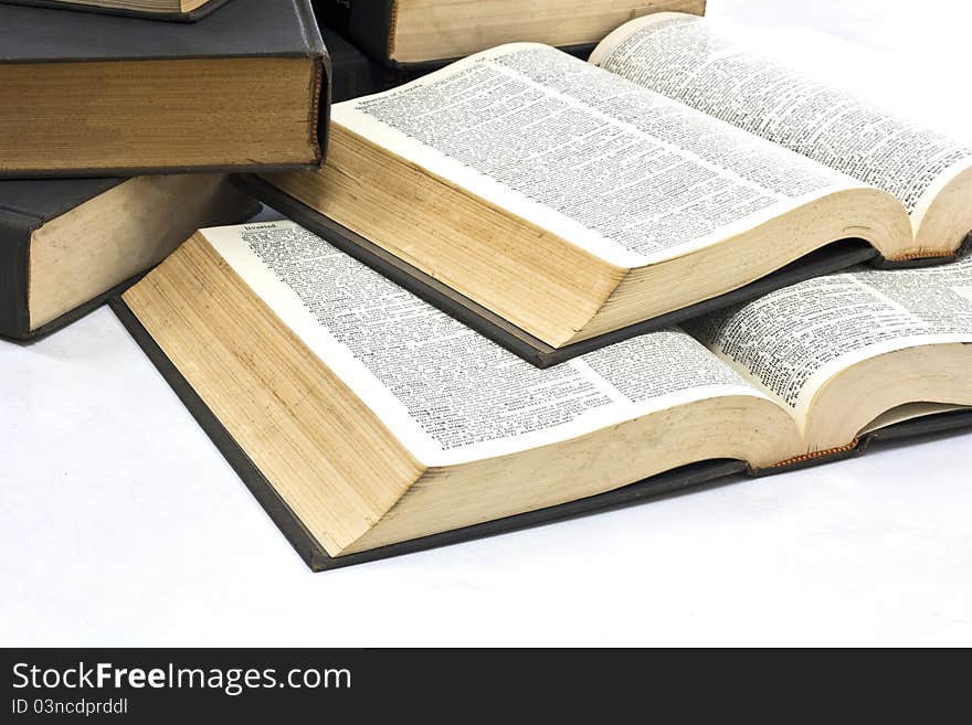 Pile of books on white table