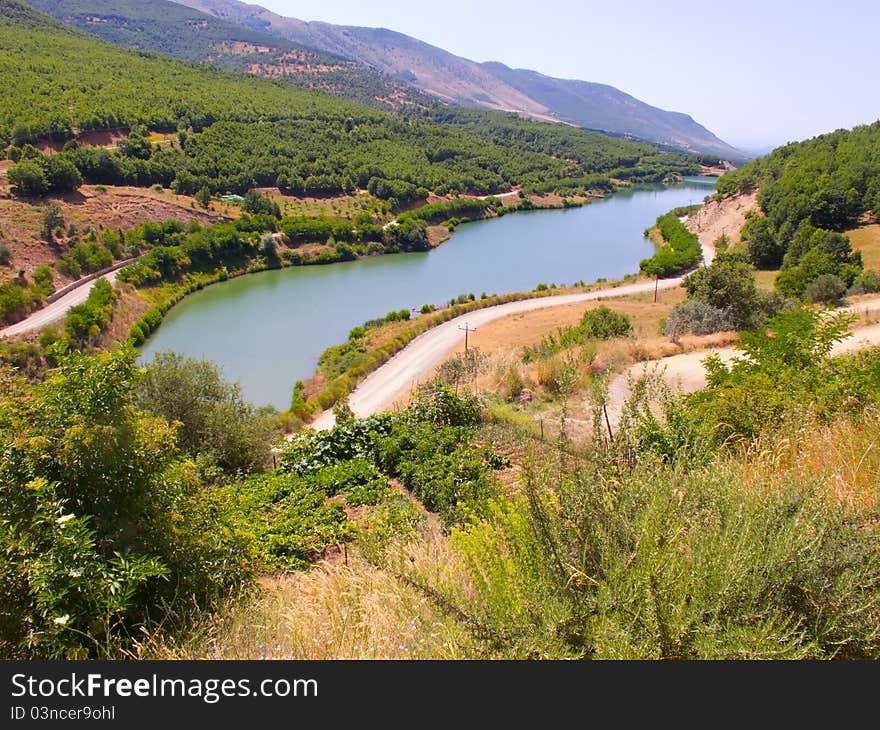 Small river between agriculture fields of vineyards