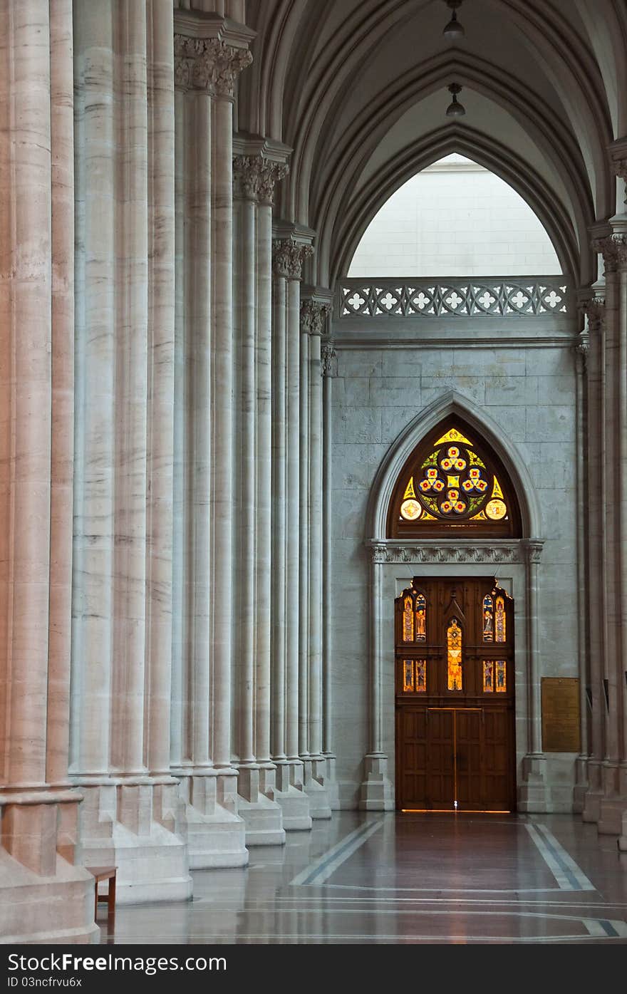 Corridor of the gothic cathedral in the background the vitreaux. Corridor of the gothic cathedral in the background the vitreaux