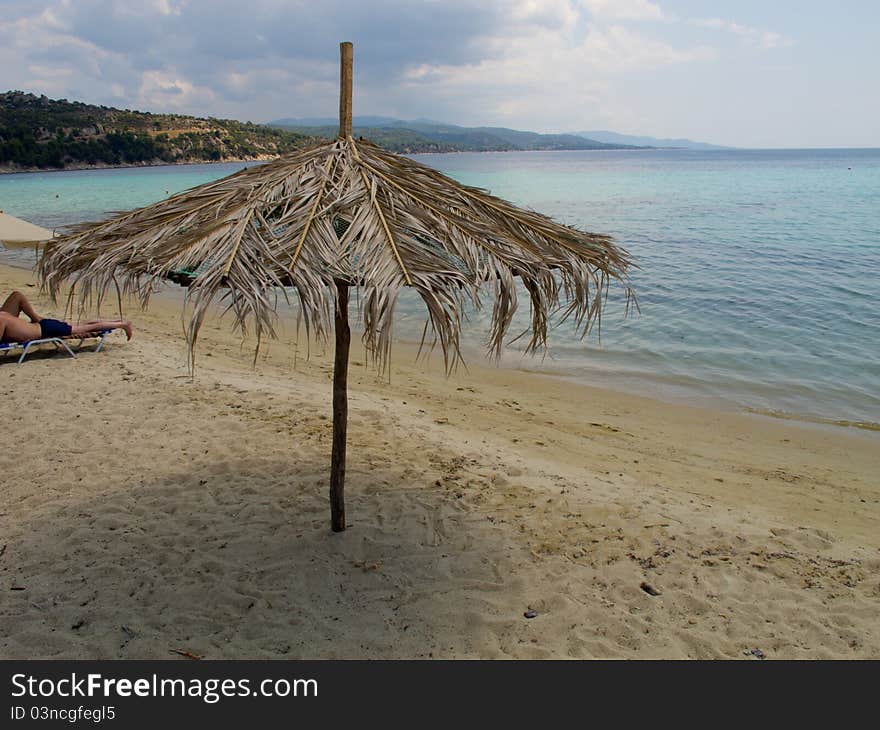 Umbrellas on a greek beach in halkidiki. Umbrellas on a greek beach in halkidiki