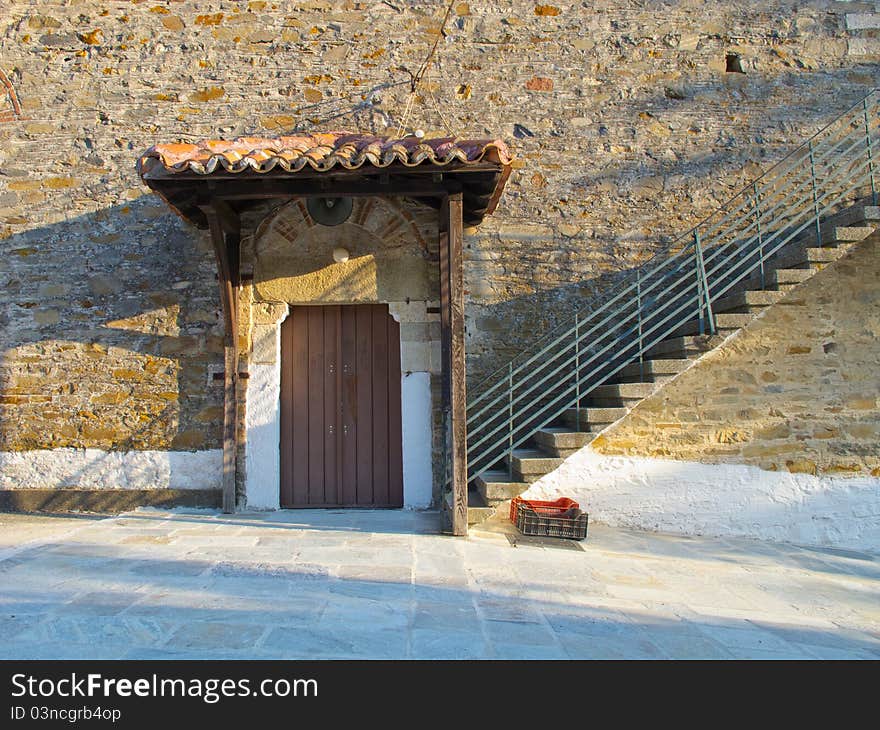 Old stone house with wooden doors windows and balkony in a greek vilage in halkidiki