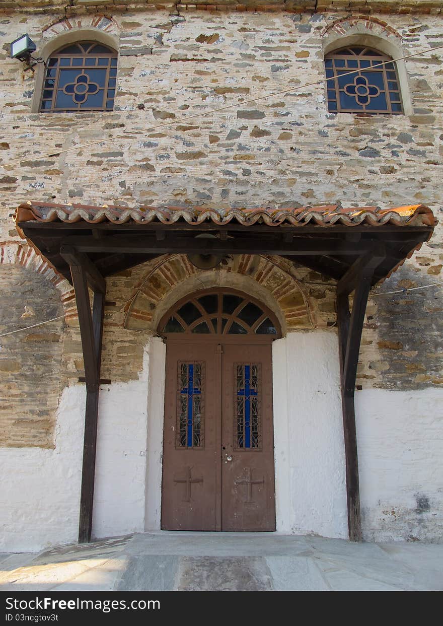 Old stone house with wooden doors windows and balkony in a greek vilage in halkidiki