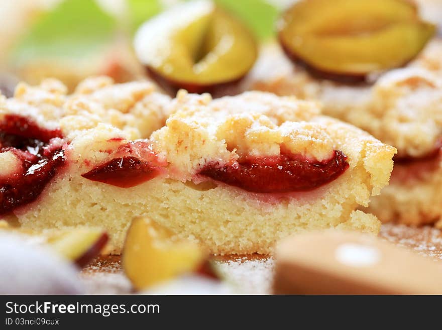 Slice of plum cake with crumb topping