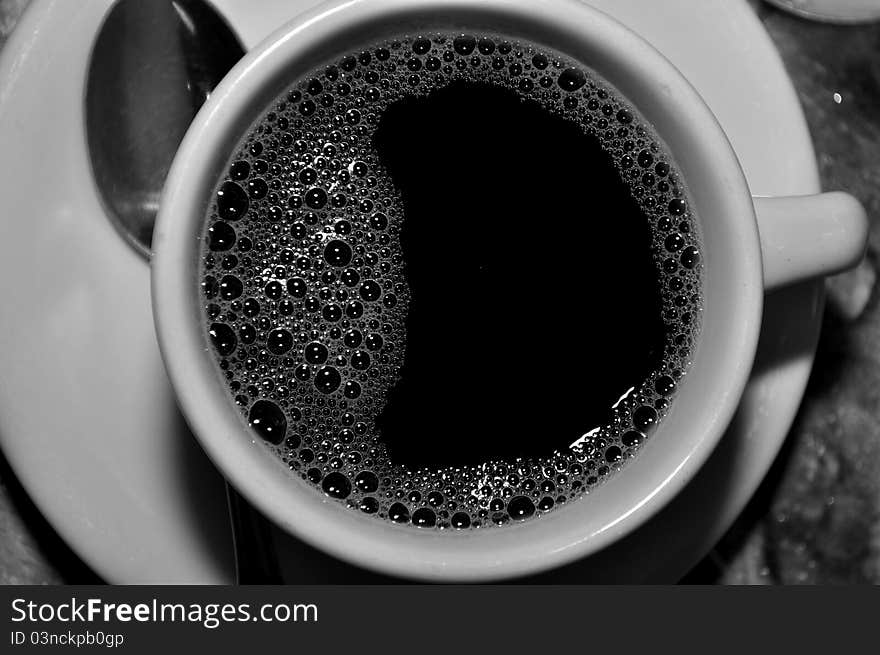 Black coffee in white cup