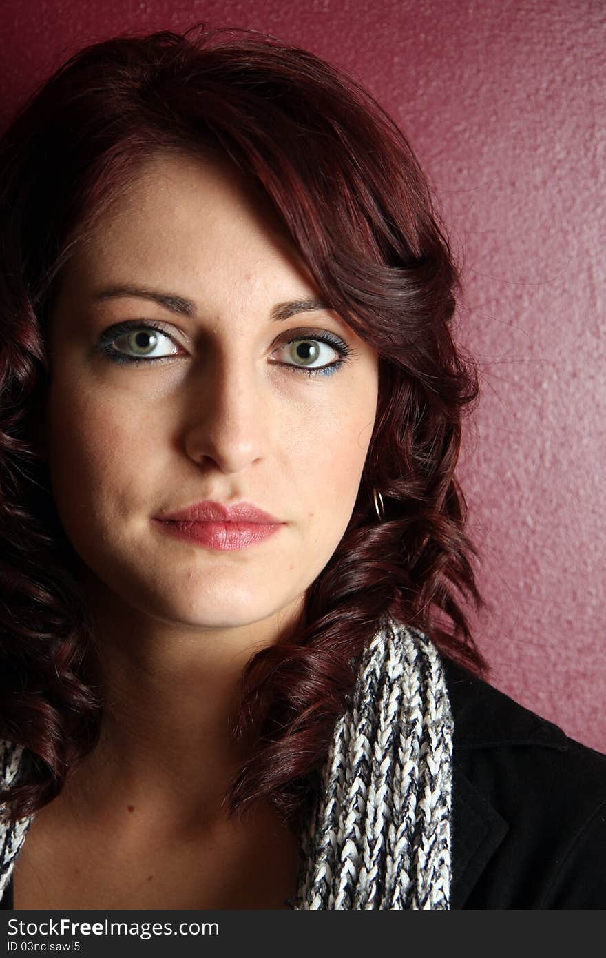 A Young Caucasian woman poses for portrait. A Young Caucasian woman poses for portrait.