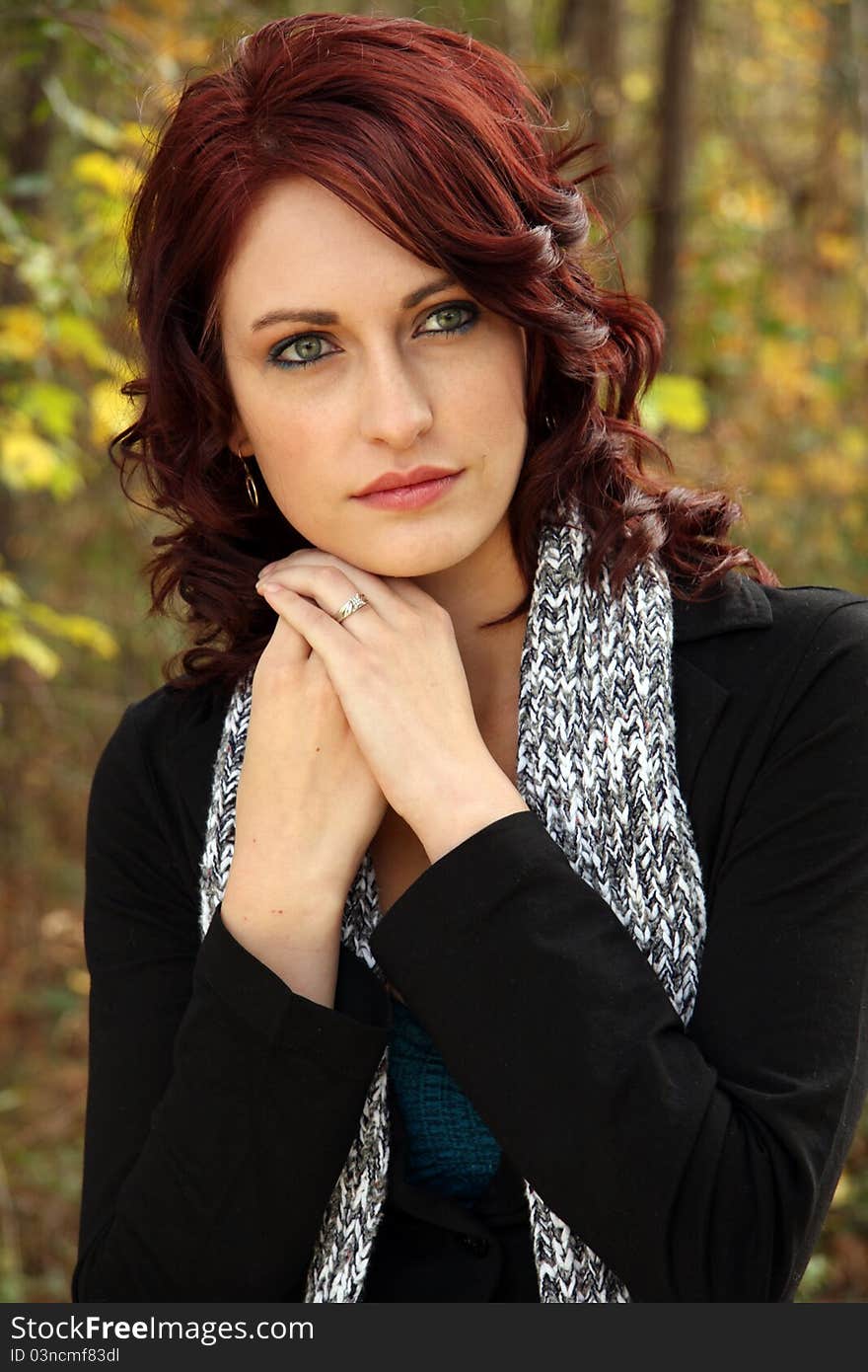 A Young Caucasian woman poses for portrait. A Young Caucasian woman poses for portrait.