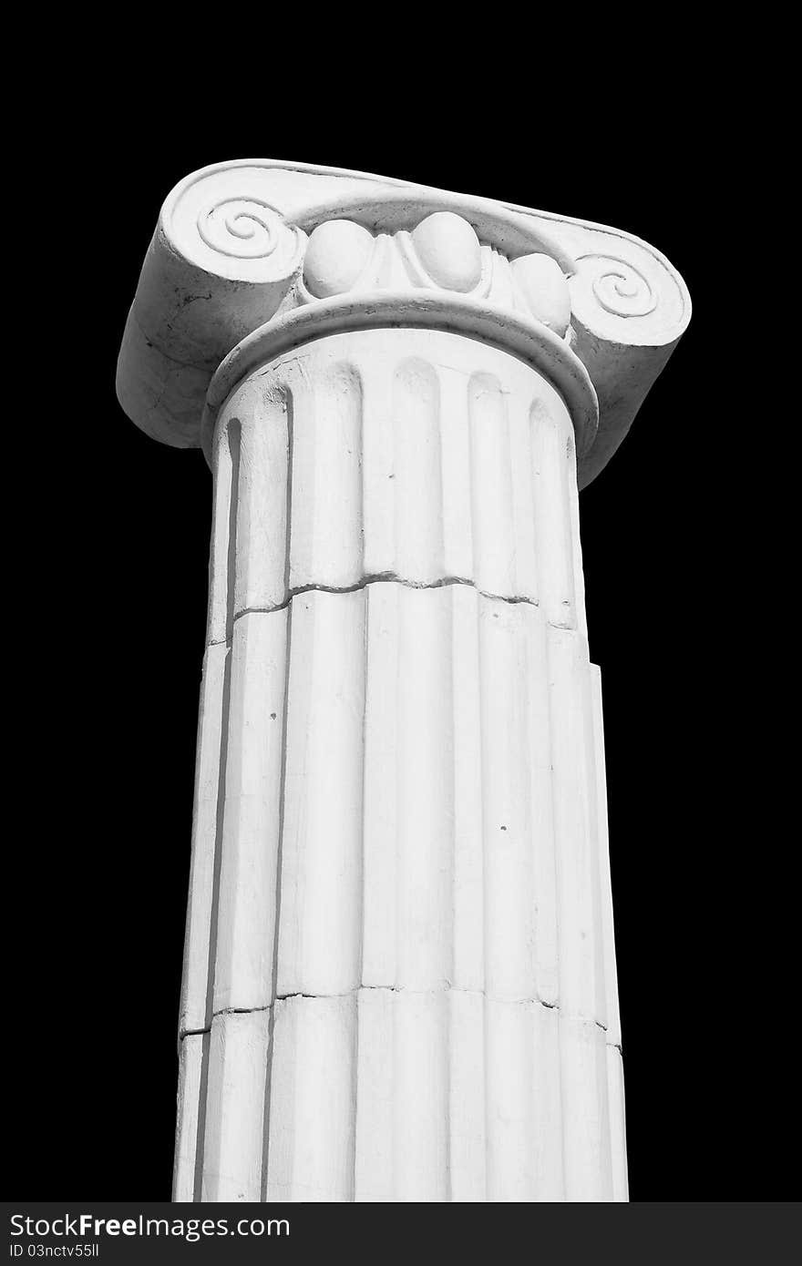 A fragment of Greek columns on a black background. isolated. A fragment of Greek columns on a black background. isolated