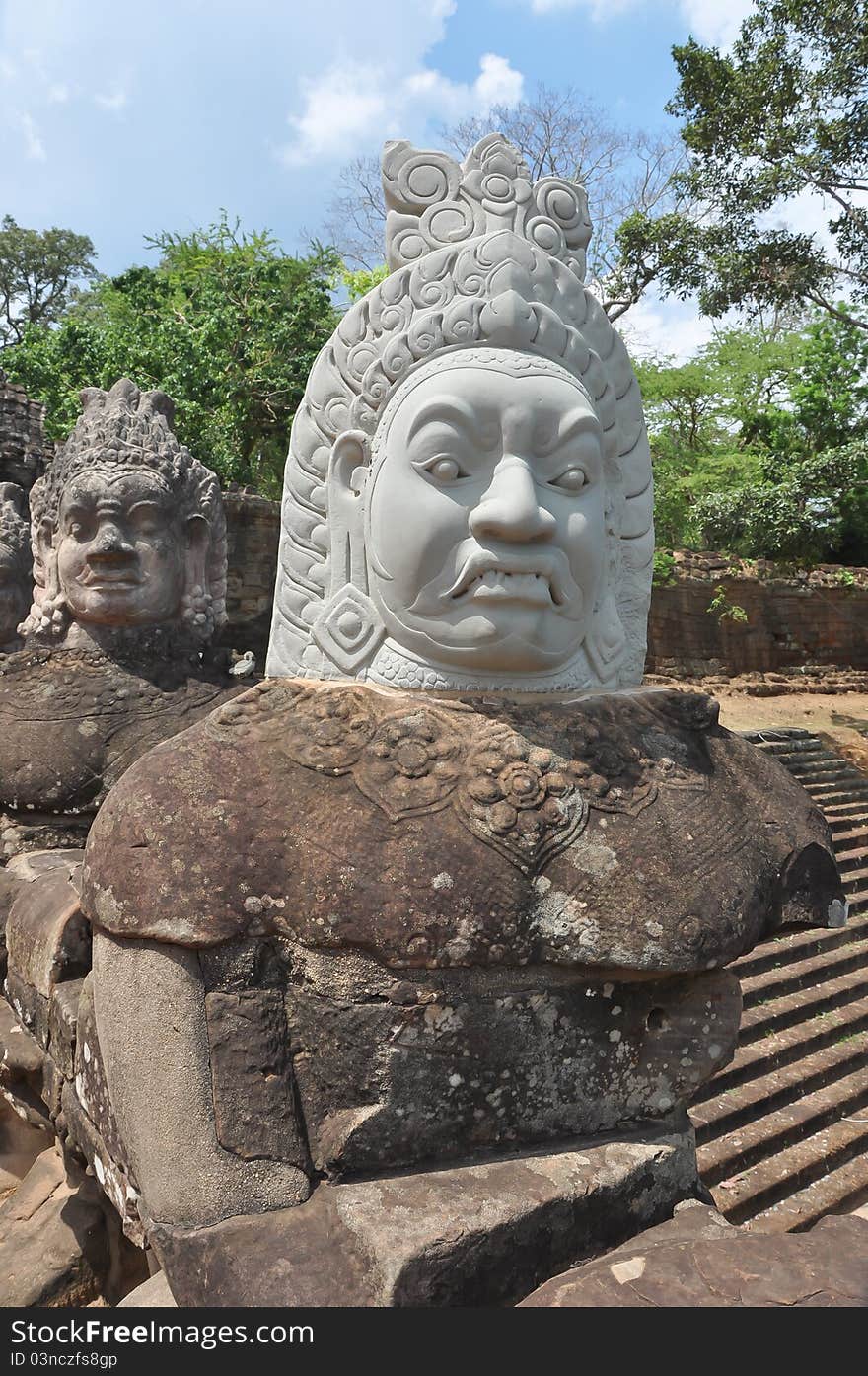 A statue to a Khmer God with an expressive face taken in Angkor Wat, Cambodia. During the war it was beheaded, so the head was later restructured. A statue to a Khmer God with an expressive face taken in Angkor Wat, Cambodia. During the war it was beheaded, so the head was later restructured.