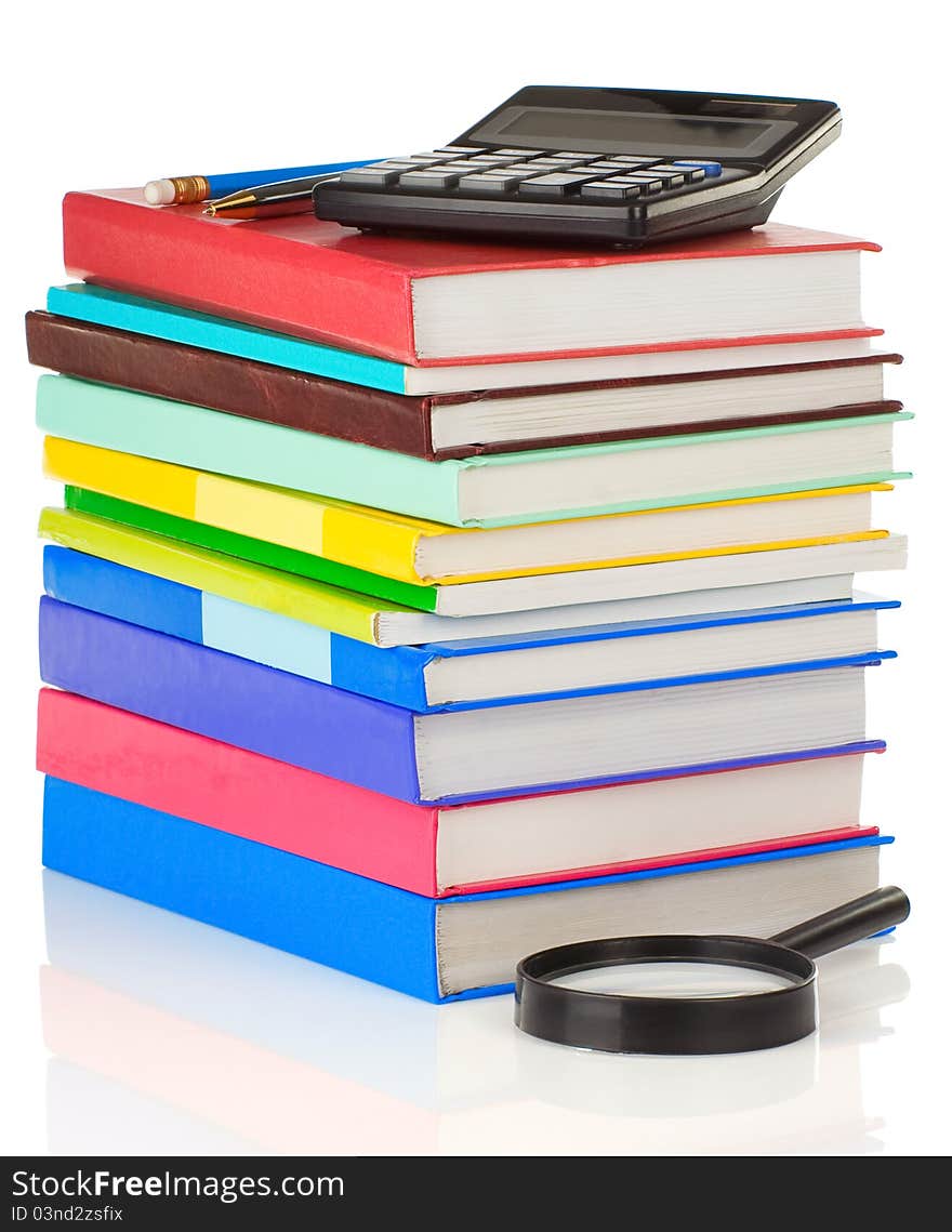 Pile Of Books And Pens On White