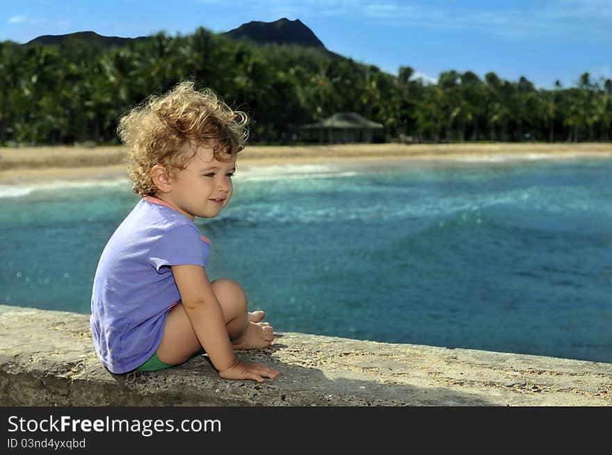 Little girl on the peer having fun