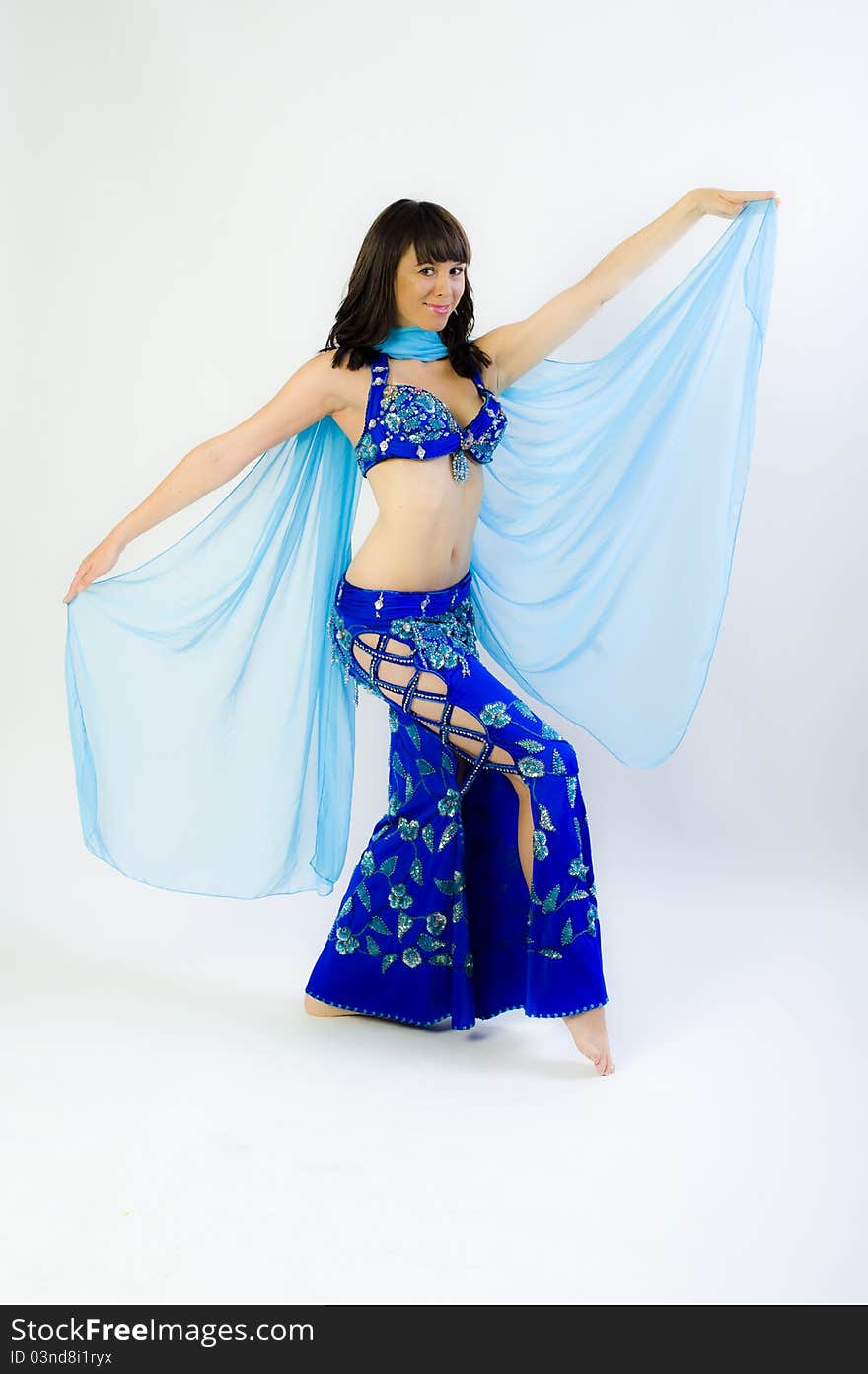 Model clothes while dancing to belly dancer