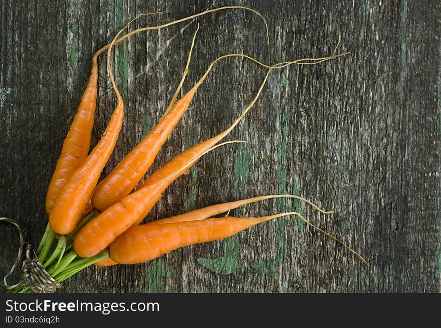 Raw carrot on wooden background. Raw carrot on wooden background