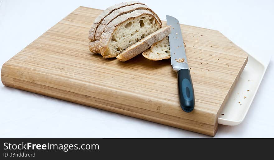 Bread and knife on a cutting board