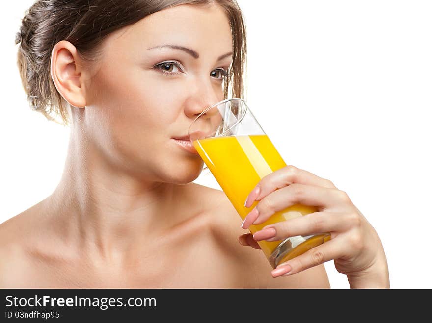 Young beautiful woman drinking orange juice isolated on a white background