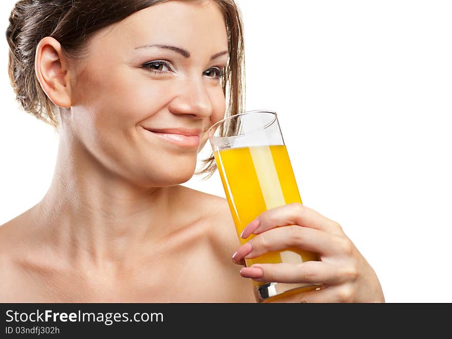 Young beautiful woman drinking orange juice isolated on a white background