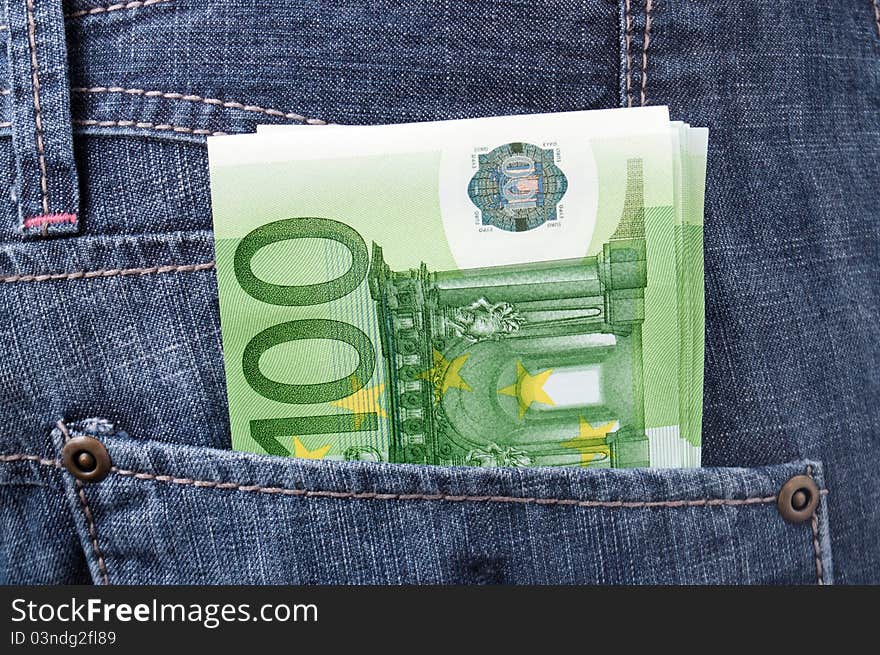 Euro money in jeans pocket