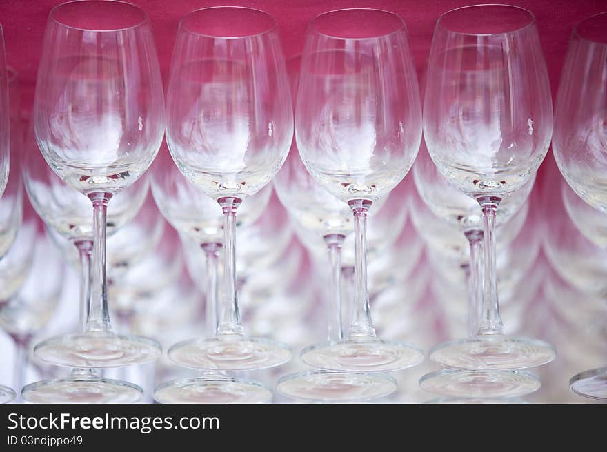 Wine glasses on red background