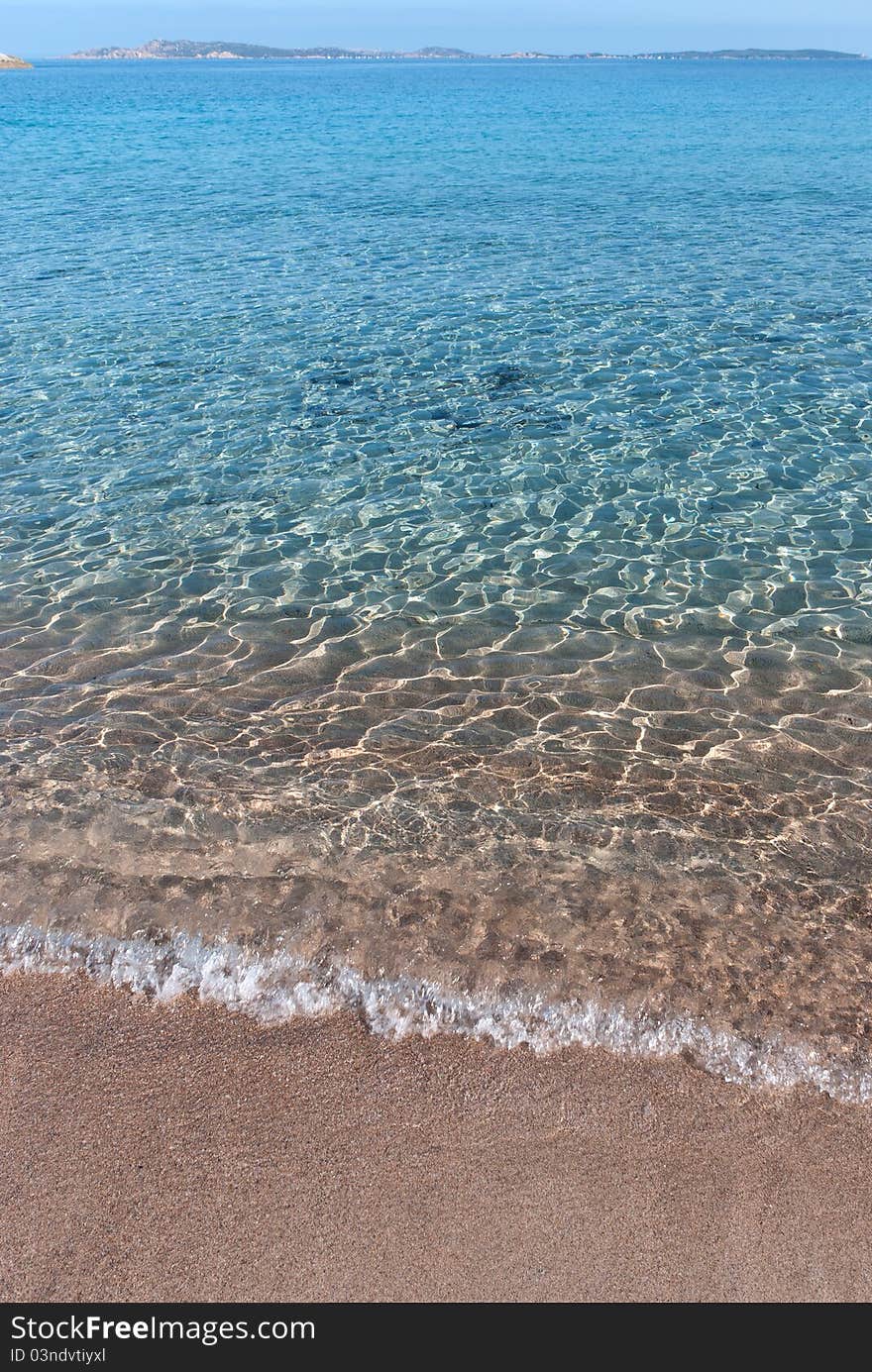 Clear sea on the beach on the island of La Maddalena Lower Trinity. Clear sea on the beach on the island of La Maddalena Lower Trinity