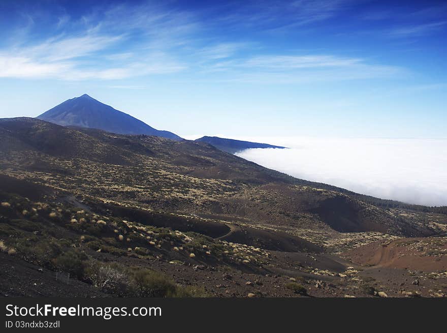 Summit of mount teide above sea of clouds. tenerife