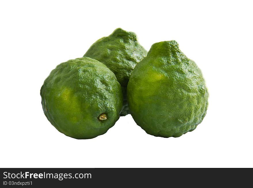 Three kaffir limes on white background