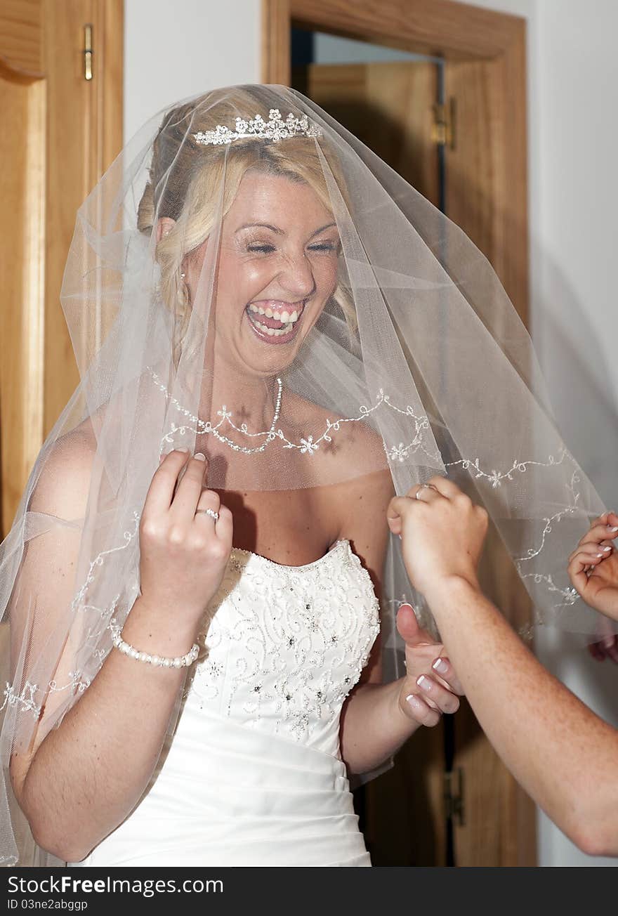 Bride putting on her dress on her wedding day. Bride putting on her dress on her wedding day