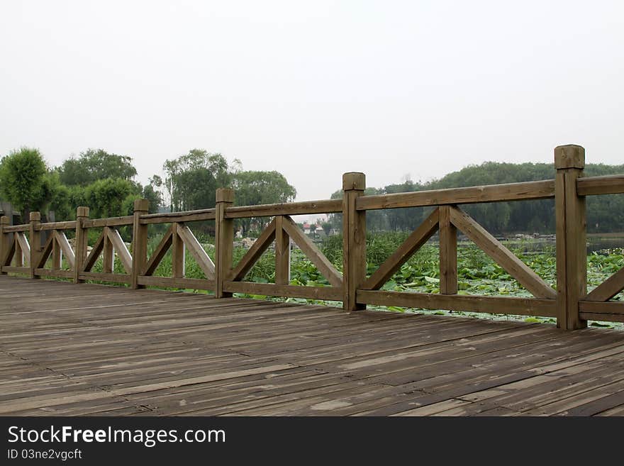 Wood bridge in a park in spring