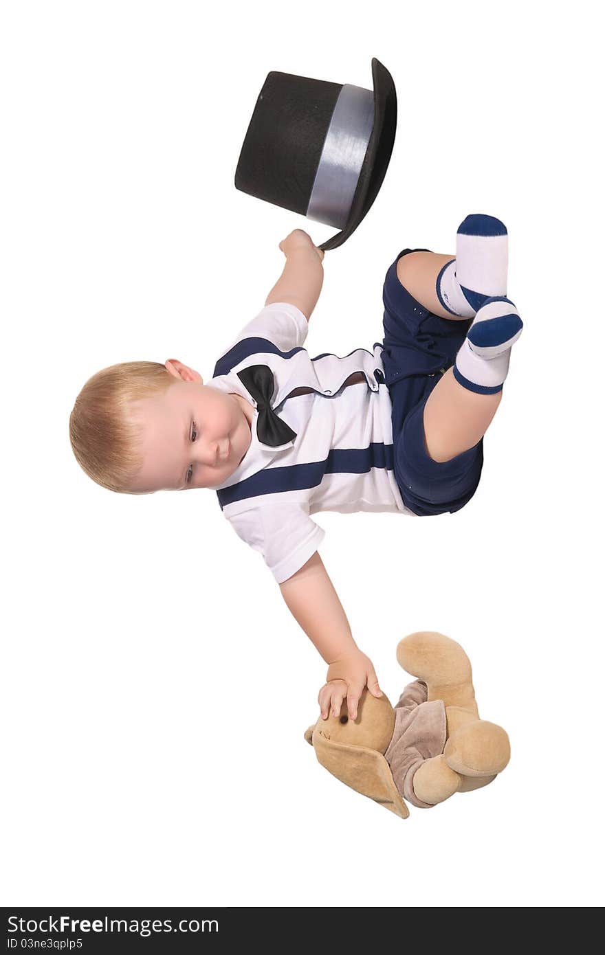 Baby boy with toy rabbit and cylinder hat