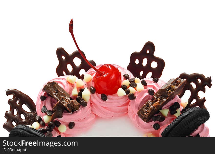 Cherry and chocolate on pink smooth cream cake