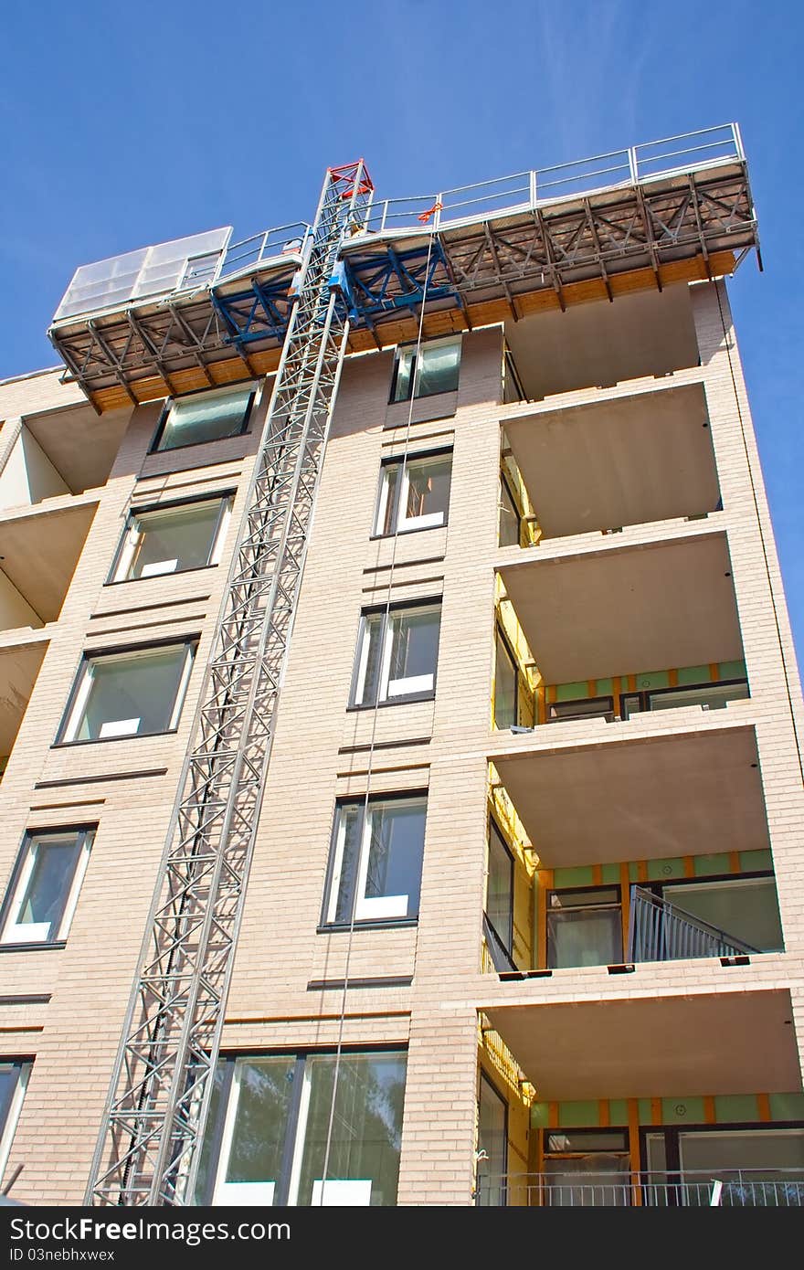 Construction elevator (access platform) lifted up, vertical shot. Construction elevator (access platform) lifted up, vertical shot