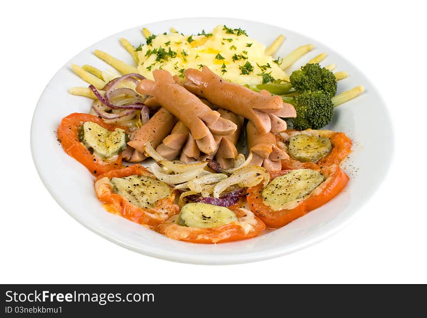 Cooked wieners with mashed potato and barbecued tomato cucumber cheese slices, and fried red onions.  Isolated on white. Cooked wieners with mashed potato and barbecued tomato cucumber cheese slices, and fried red onions.  Isolated on white.