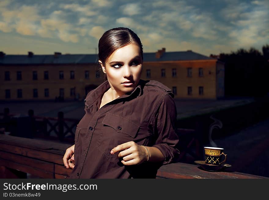 Young beautiful lady drinking coffee. Young beautiful lady drinking coffee