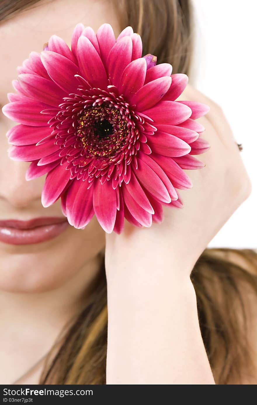 Young blond woman with flower