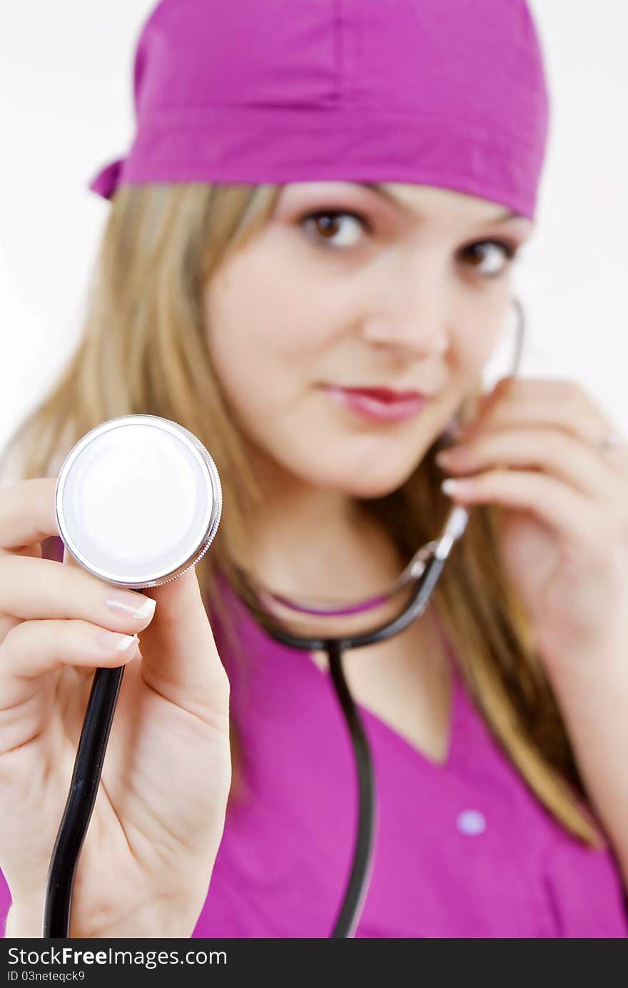 Beautiful nurse with stethoscope in her hand