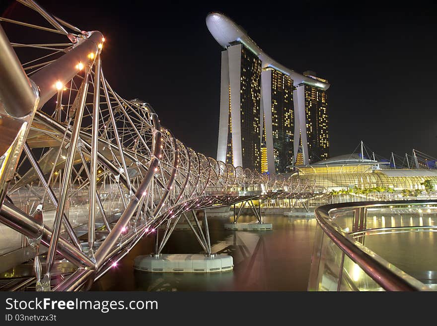 Night shot of Marina Bay Sands Hotel and Integrated Resort and The Helix Bridge. Night shot of Marina Bay Sands Hotel and Integrated Resort and The Helix Bridge