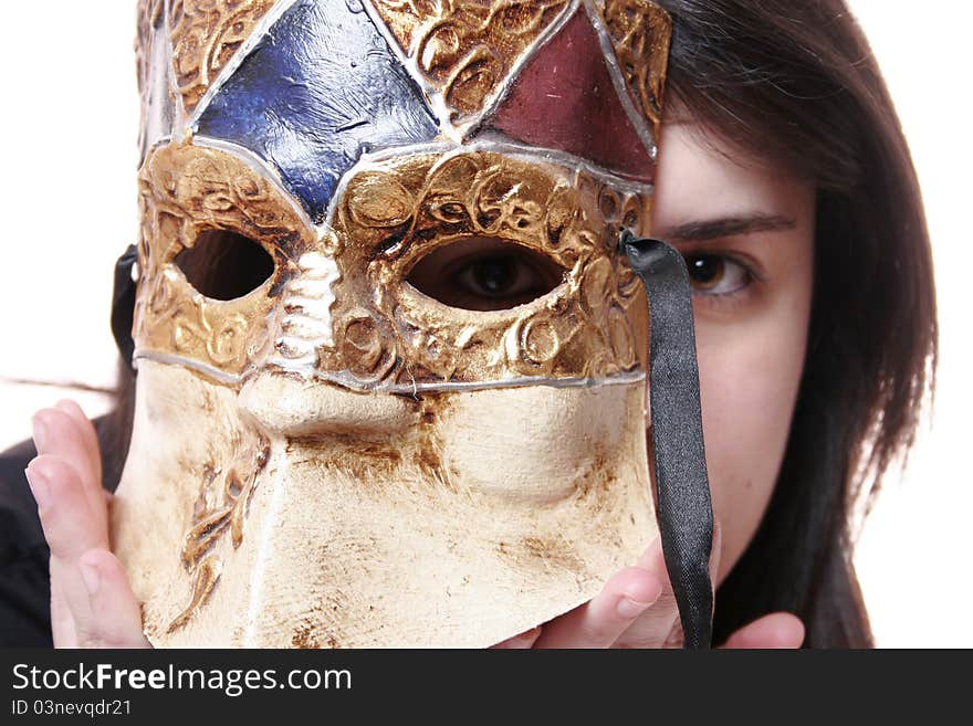 Photo of a woman with a Venetian mask that hides part of his face. Photo of a woman with a Venetian mask that hides part of his face