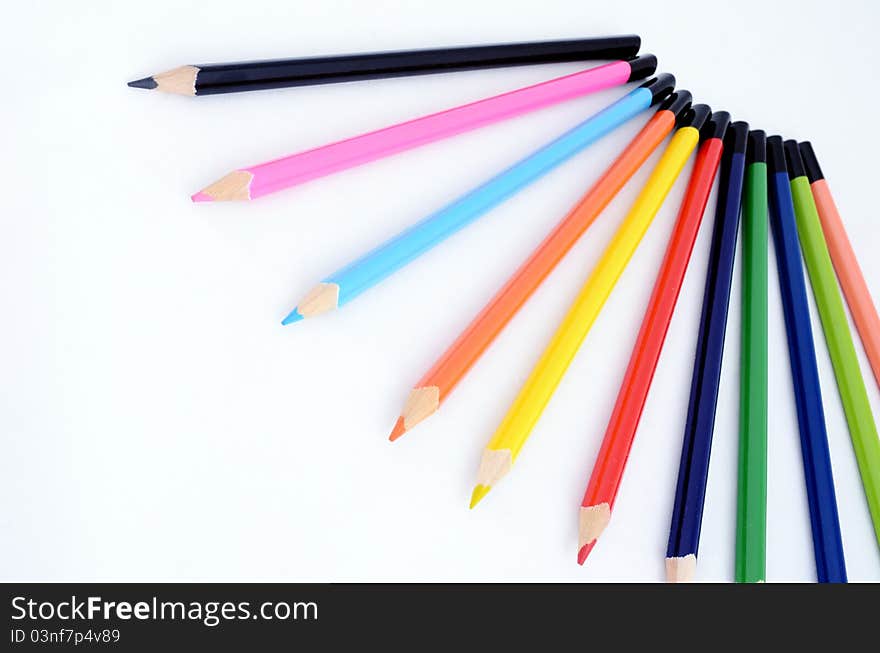 Colored pencils for children isolated on white background