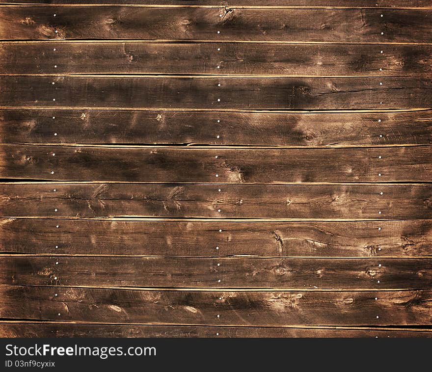 Close up of a wood fence with nails. Close up of a wood fence with nails