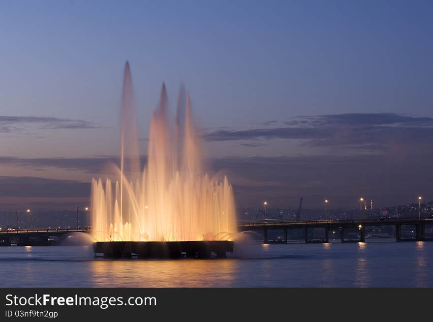 A fountain in the Golden Horn, behind the Unkapani Bridge. Istanbul-Turkey. A fountain in the Golden Horn, behind the Unkapani Bridge. Istanbul-Turkey