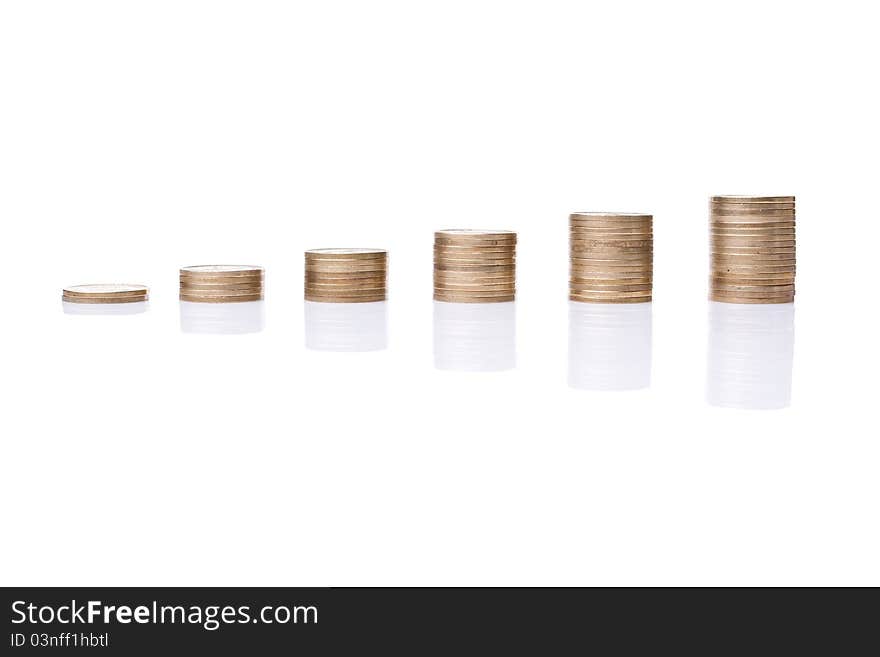 Stacks of coins like diagram with reflection against a white background