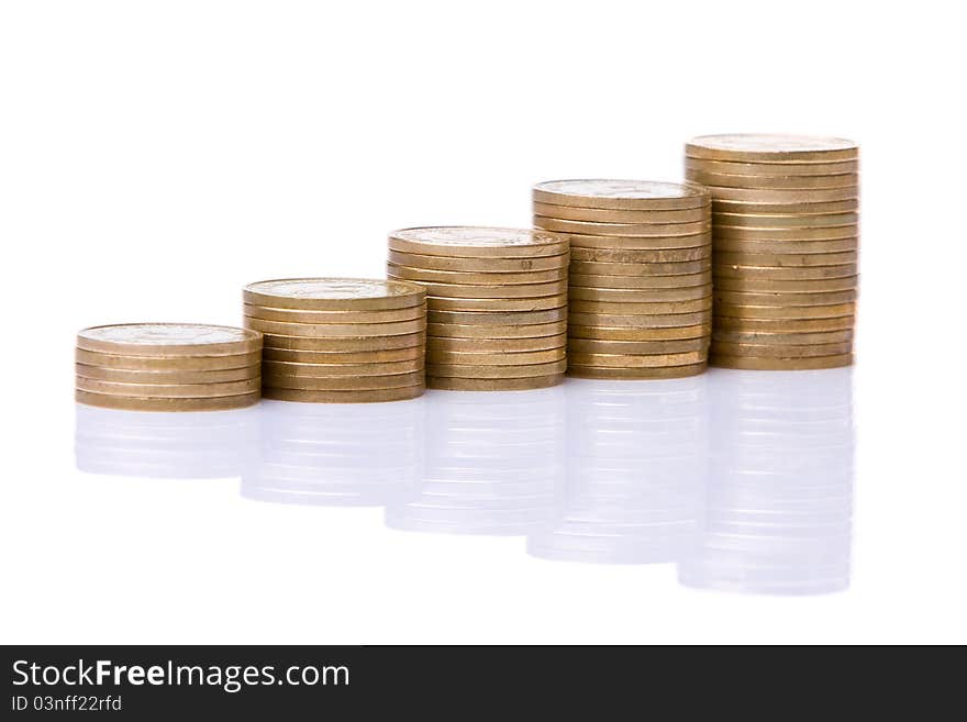 Stacks of coins like diagram with reflection against a white background