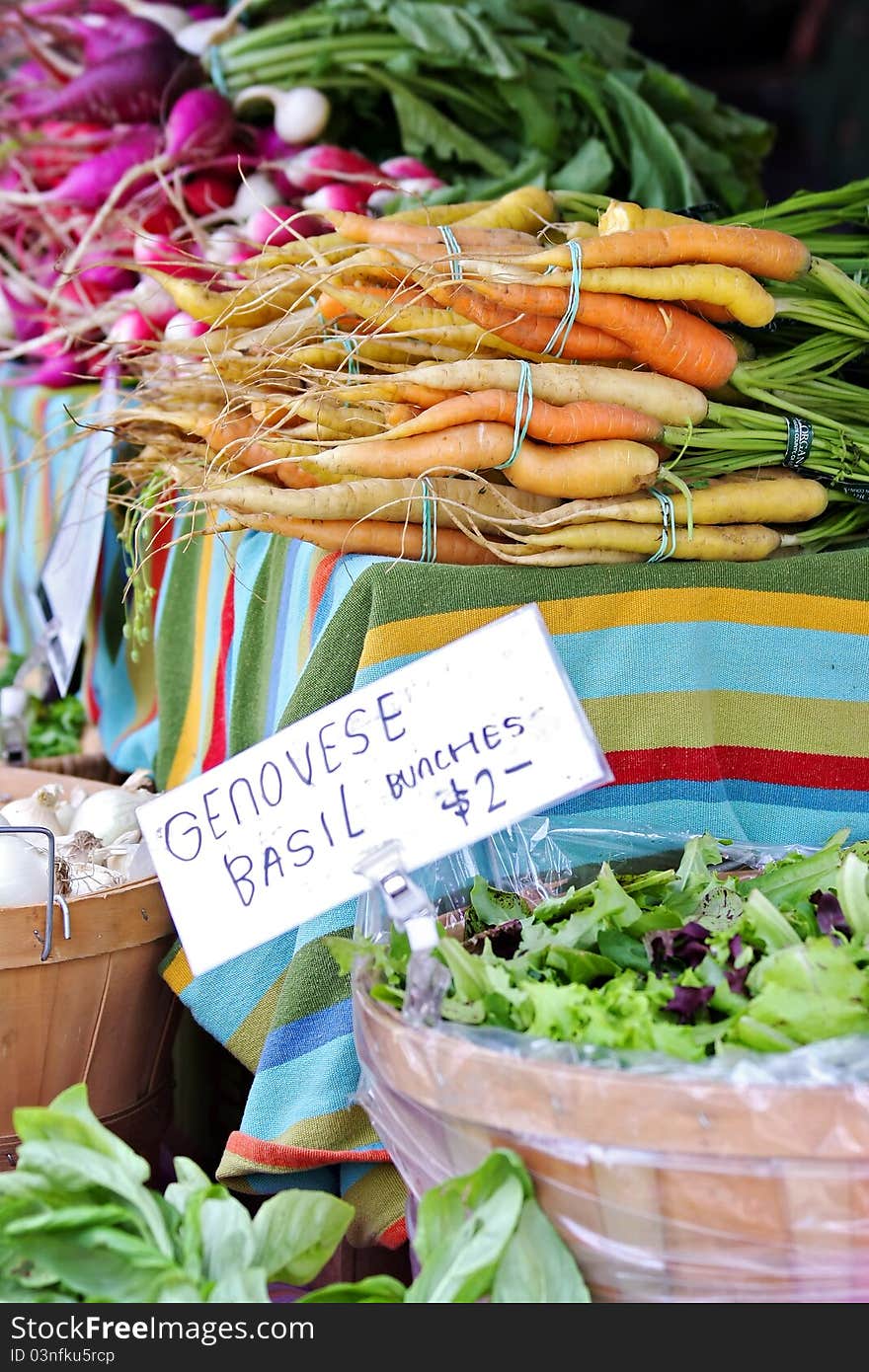 Carrots, radishes and herbs at farmer's market. Carrots, radishes and herbs at farmer's market.