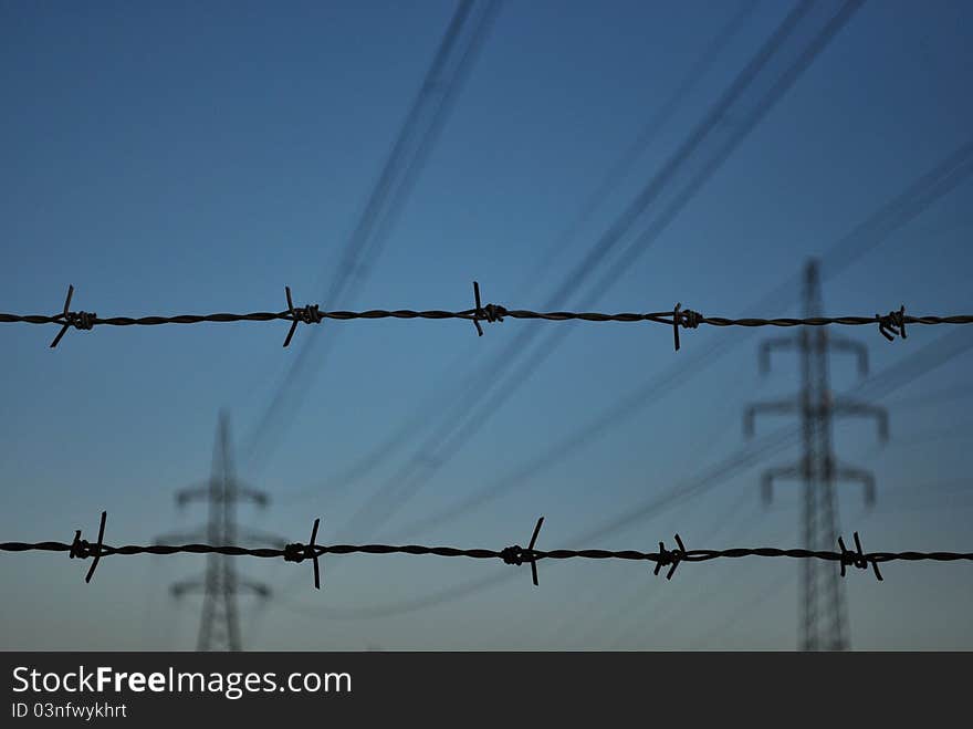 Barbed wires with high voltage. Barbed wires with high voltage