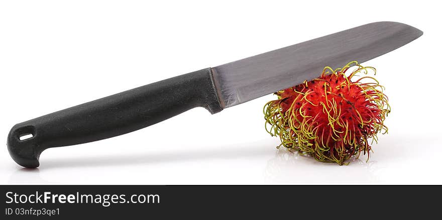 Knife and Rambutan on white background