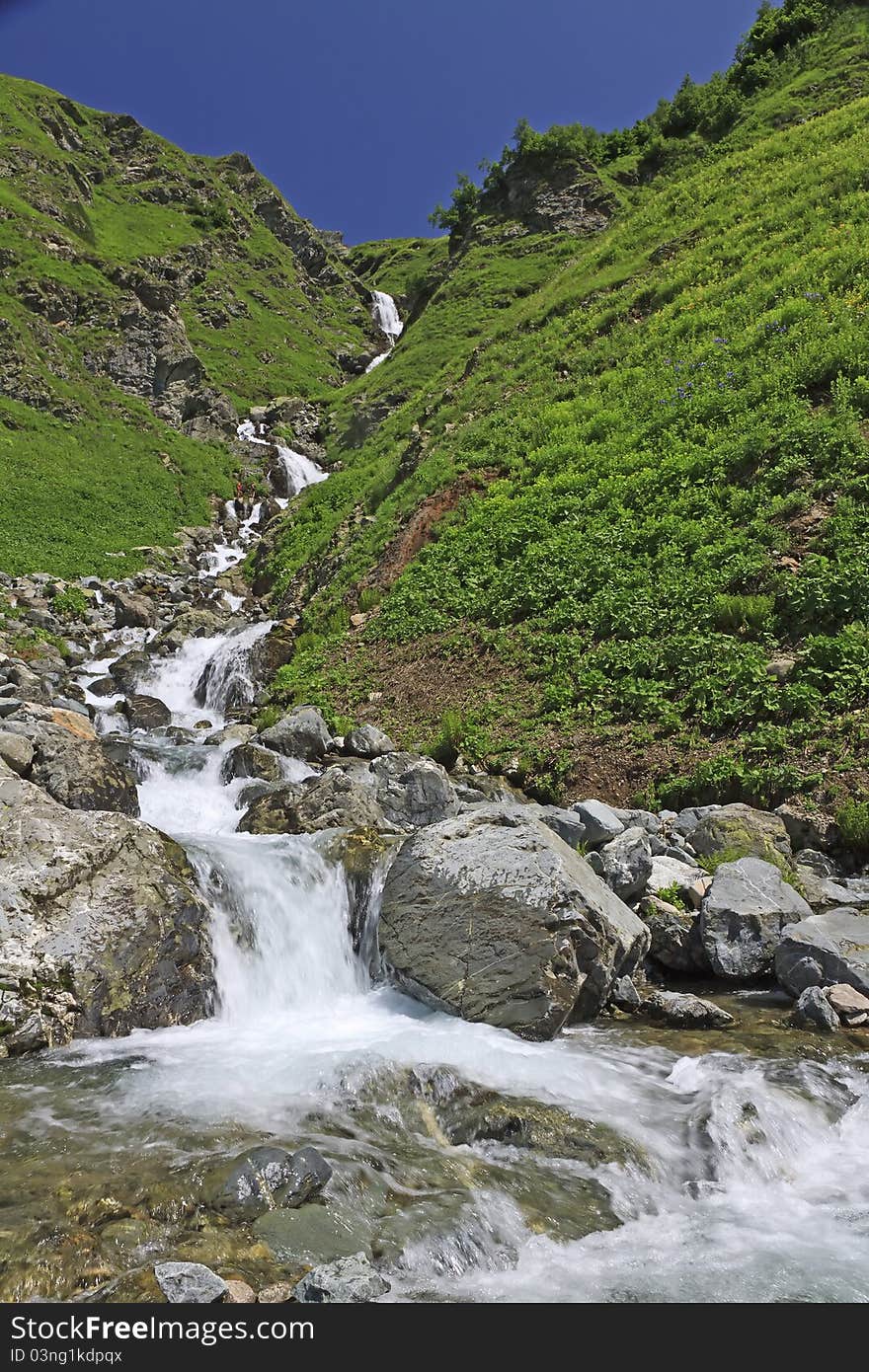 Beautiful waterfalls in summer sunny day